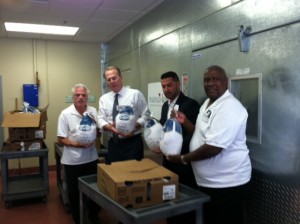 Mayor Kevin Faulconer presents 28 turkeys for the Scott Carlson Community Thanksgiving Dinner at The Center