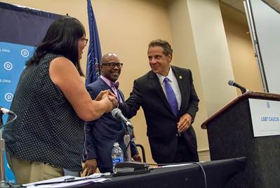 LGBT Caucus Chair Earl Fowkles and Vice Chair Laura Calvo greet New York Governor Mario Cuomo. LGBT Caucus. Pennsylvania Convention Center. (July 26, 2016) 