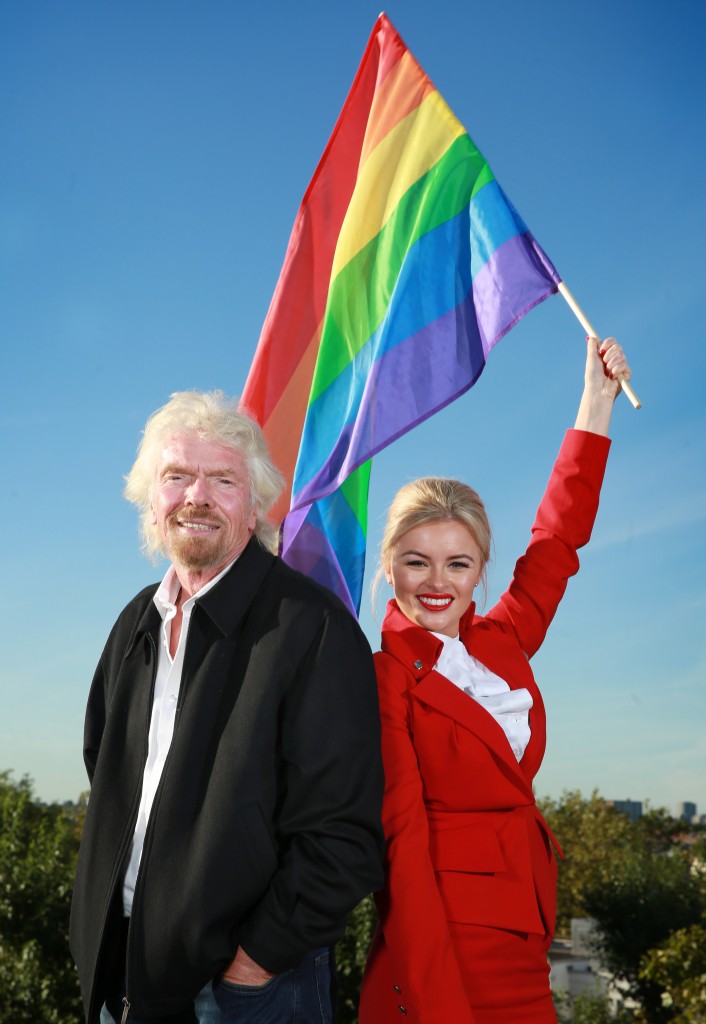 Chloe Clark (Virgin Holidays) and Richard Branson shows their support for the Virgin Holidays #LOSETHELABELS LGBT equality in travel campaign at Virgin headquarters, London | Photo: Matt Alexander/PA Wire