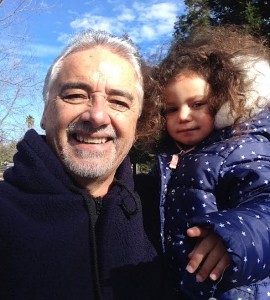 Jesus Castro, pictured with his granddaughter, says the monthly premiums for his family’s health plan through Covered California are dropping by $250.