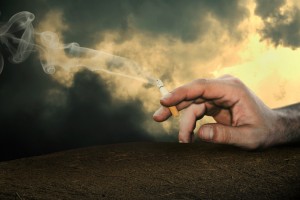 thr cigarette is in the hand of man.