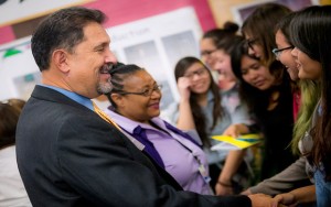 Vice Chancellor for Student Affairs Juan González greeting high school students at a UC San Diego outreach event.