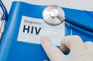 HIV diagnosis on blue folder with stethoscope.